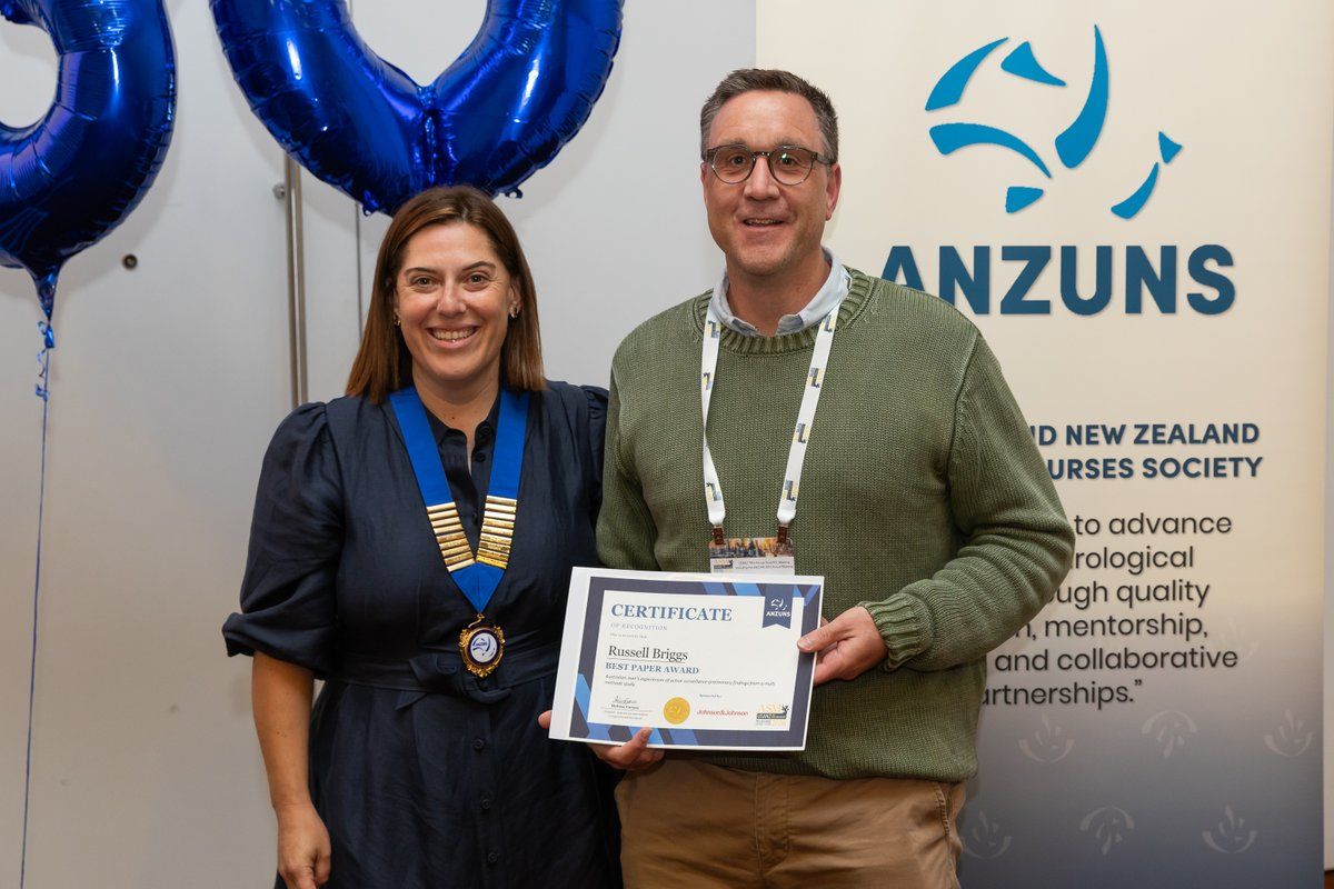 Russell Briggs receiving the Best Paper Award 2026